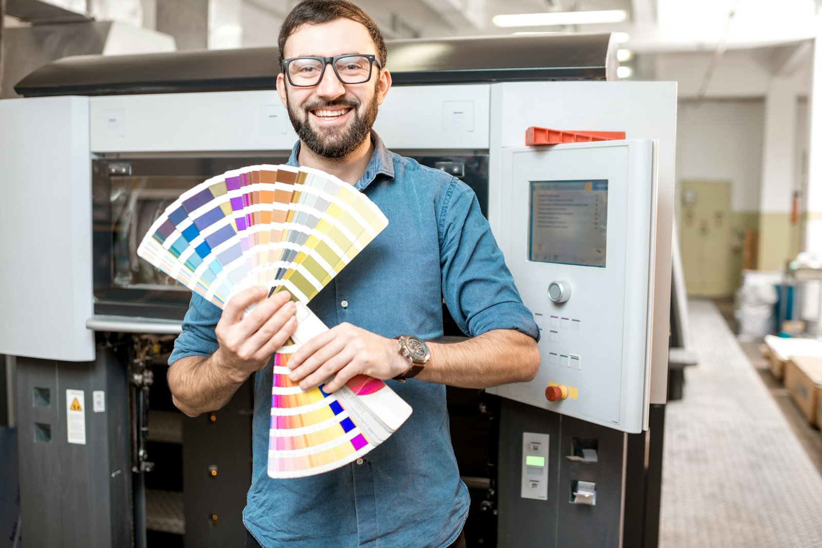 Typographer with color swatches at the manufacturing